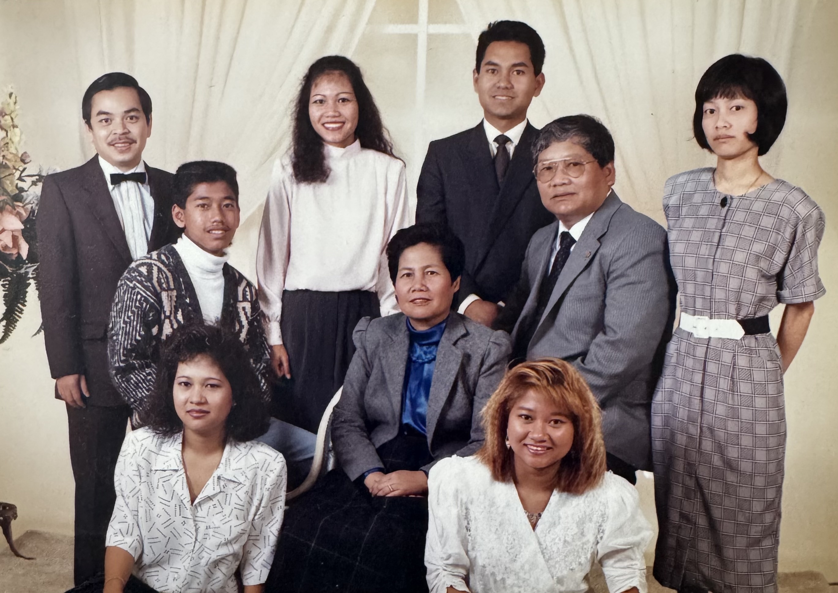 Sam surrounded by his children and family